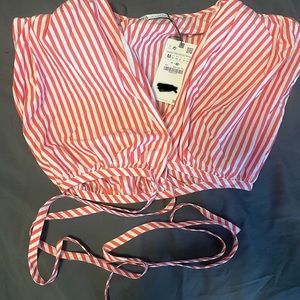 Red an white cross body crop top . I both two of this by mistake